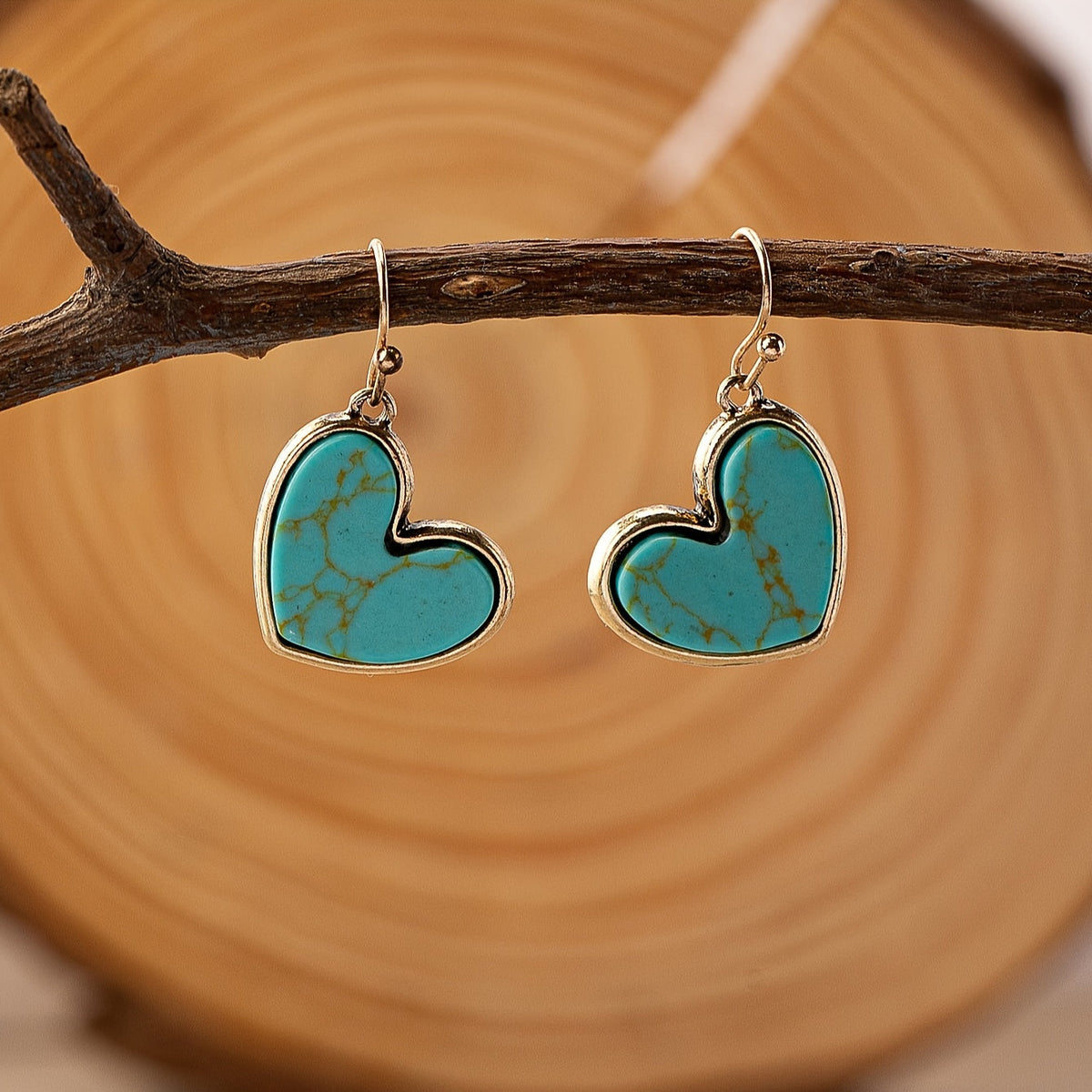 Gouden oorbellen met turquoise hart