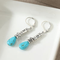Zilveren etnische oorbellen met turquoise druppel