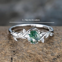Zilveren ring met mosagaat en bladmotief