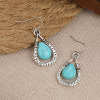 Zilveren oorbellen met wire-wrapped turquoise druppel