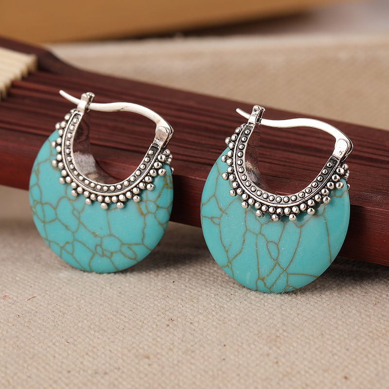Zilveren bohemian oorbellen met turquoise schijf