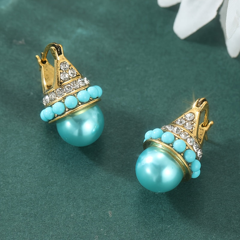 Vintage gouden oorbellen met turquoise parel