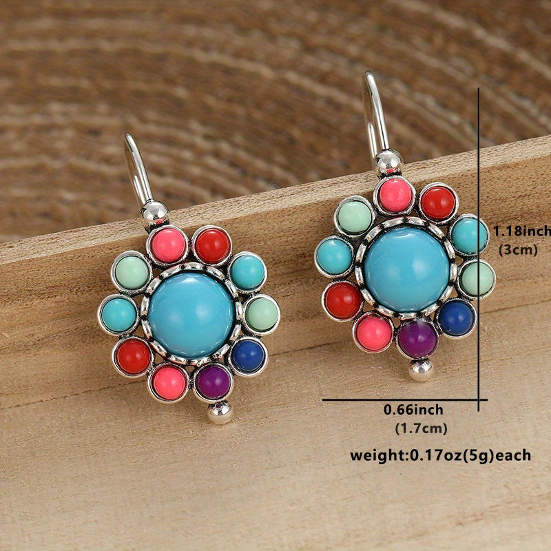 Zilveren oorbellen met turquoise bloemmotief