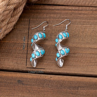 Zilveren oorbellen met spiraal en turquoise