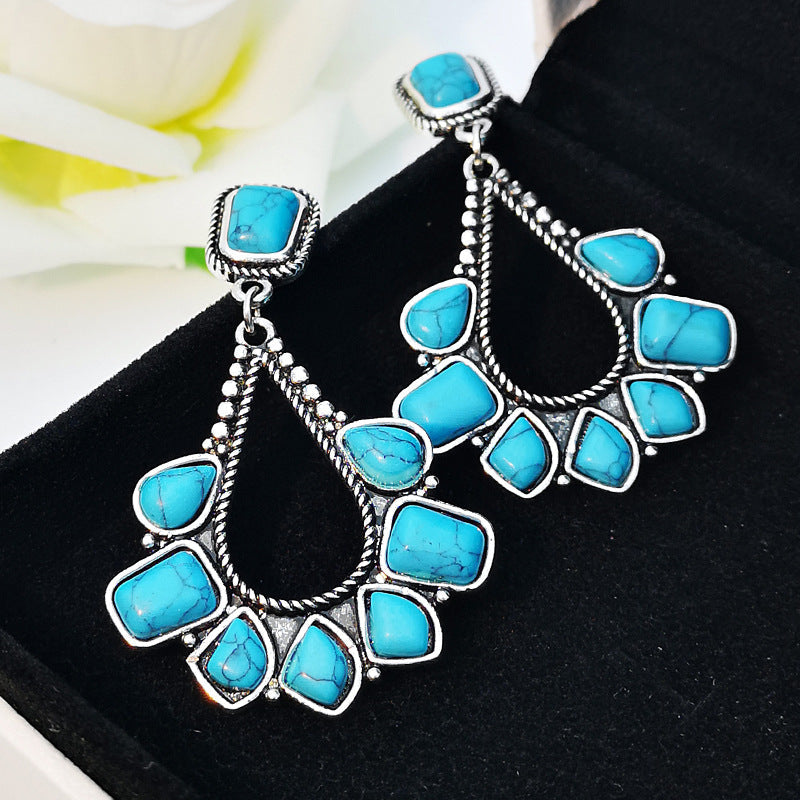 Zilveren bohemian oorbellen met turquoise waaier