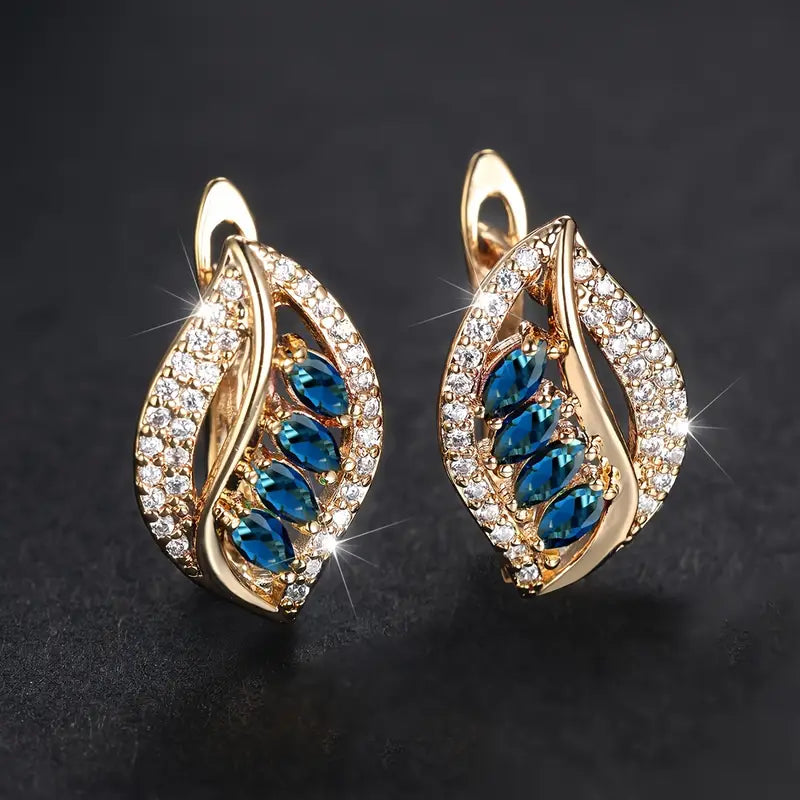 Gouden oorbellen met blauwe bladmotief