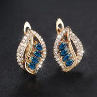 Gouden oorbellen met blauwe bladmotief