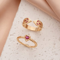 Gouden ringenset met slang en hart met roze zirkonia