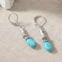 Zilveren etnische oorbellen met turquoise druppel