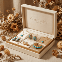 Gouden vintage oorbellen met ginkgoblad en jade druppel