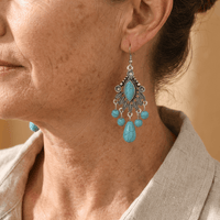 Zilveren bohemian oorbellen met turquoise kralen en bedels
