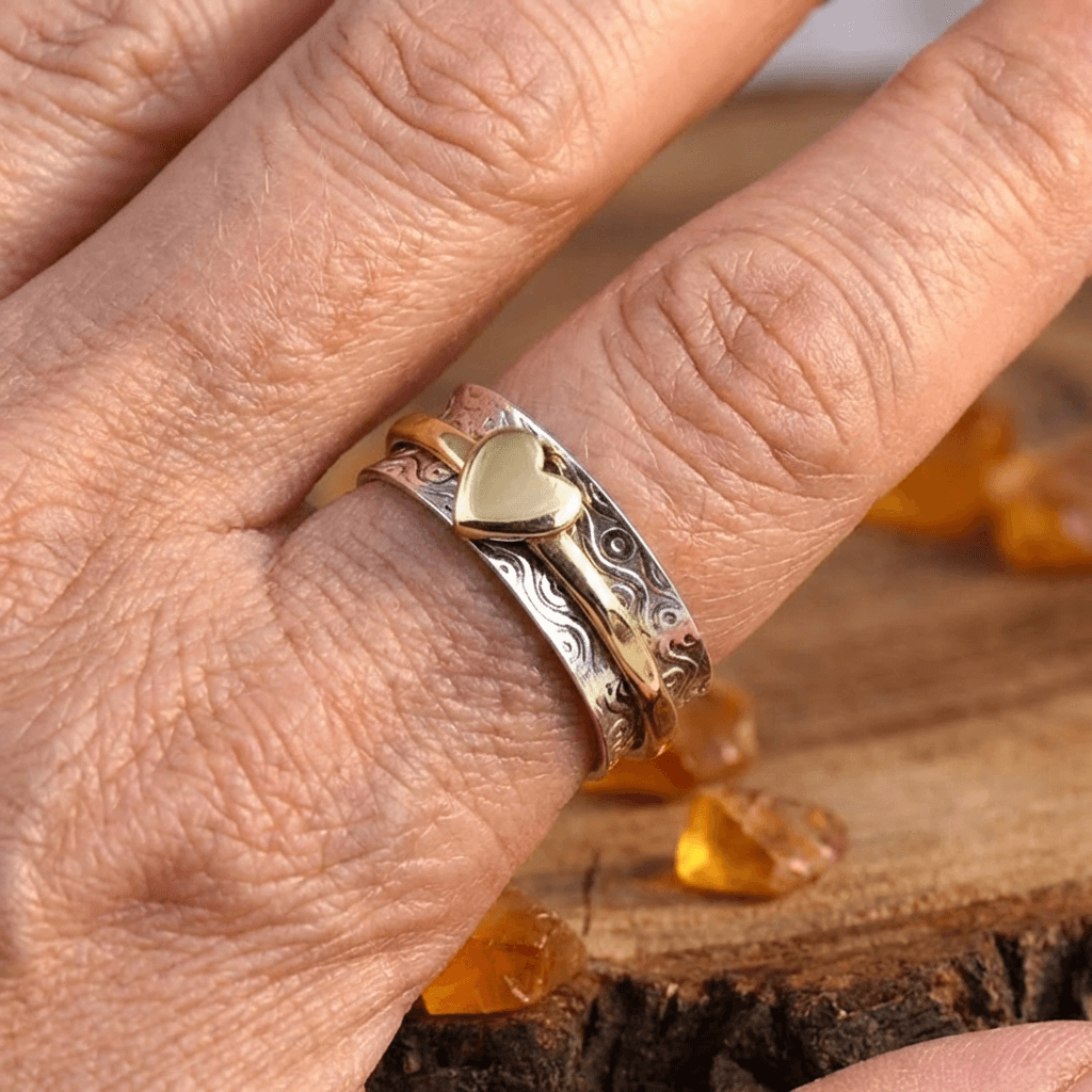 Zilveren gouden draairing met hart