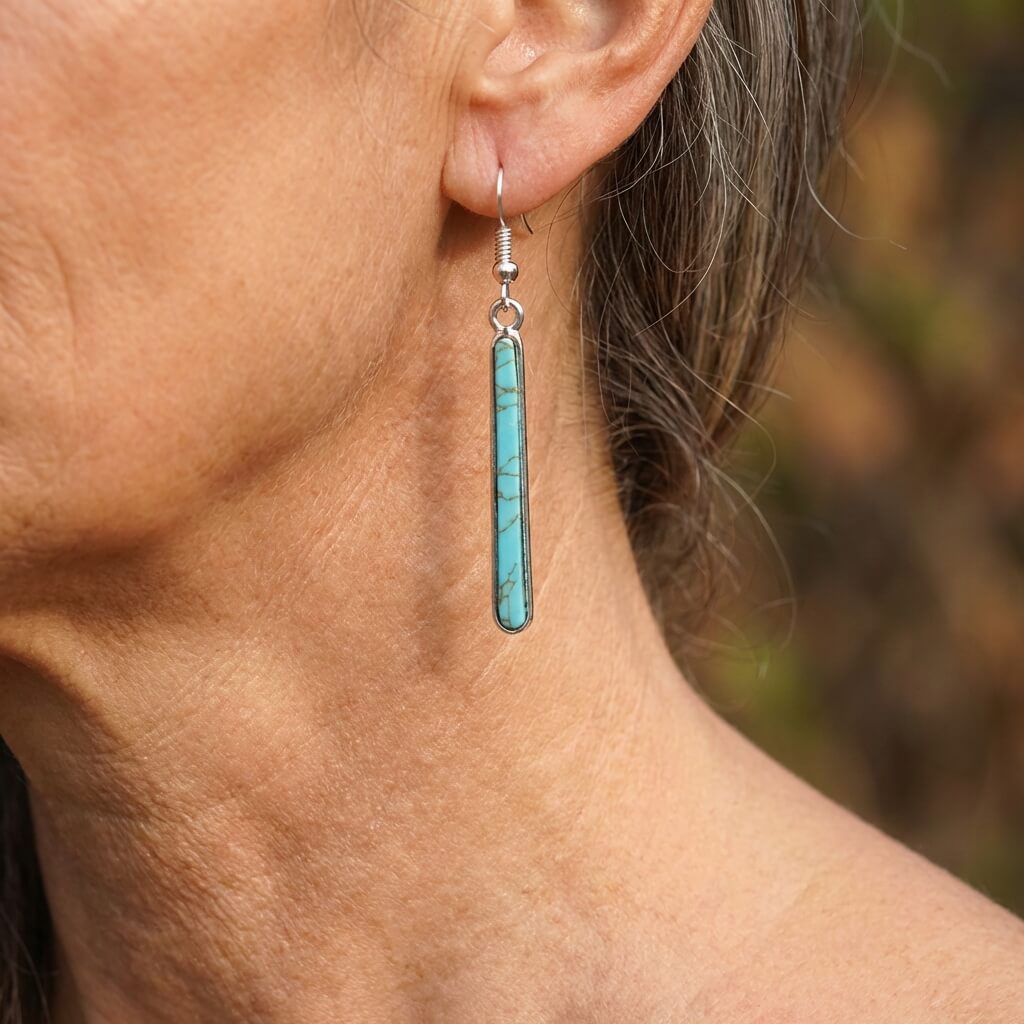 Zilveren oorbellen met langwerpige turquoise staaf