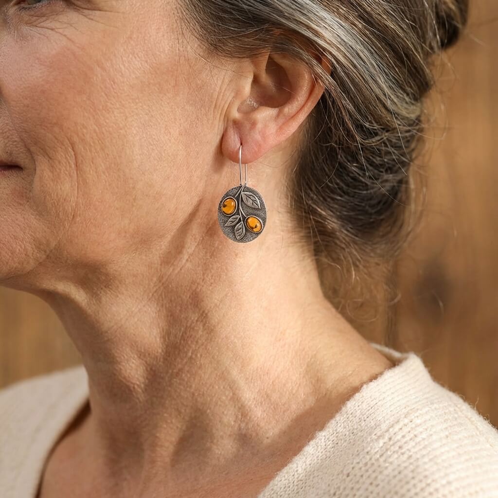 Zilveren vintage oorbellen met amber en blaadjes