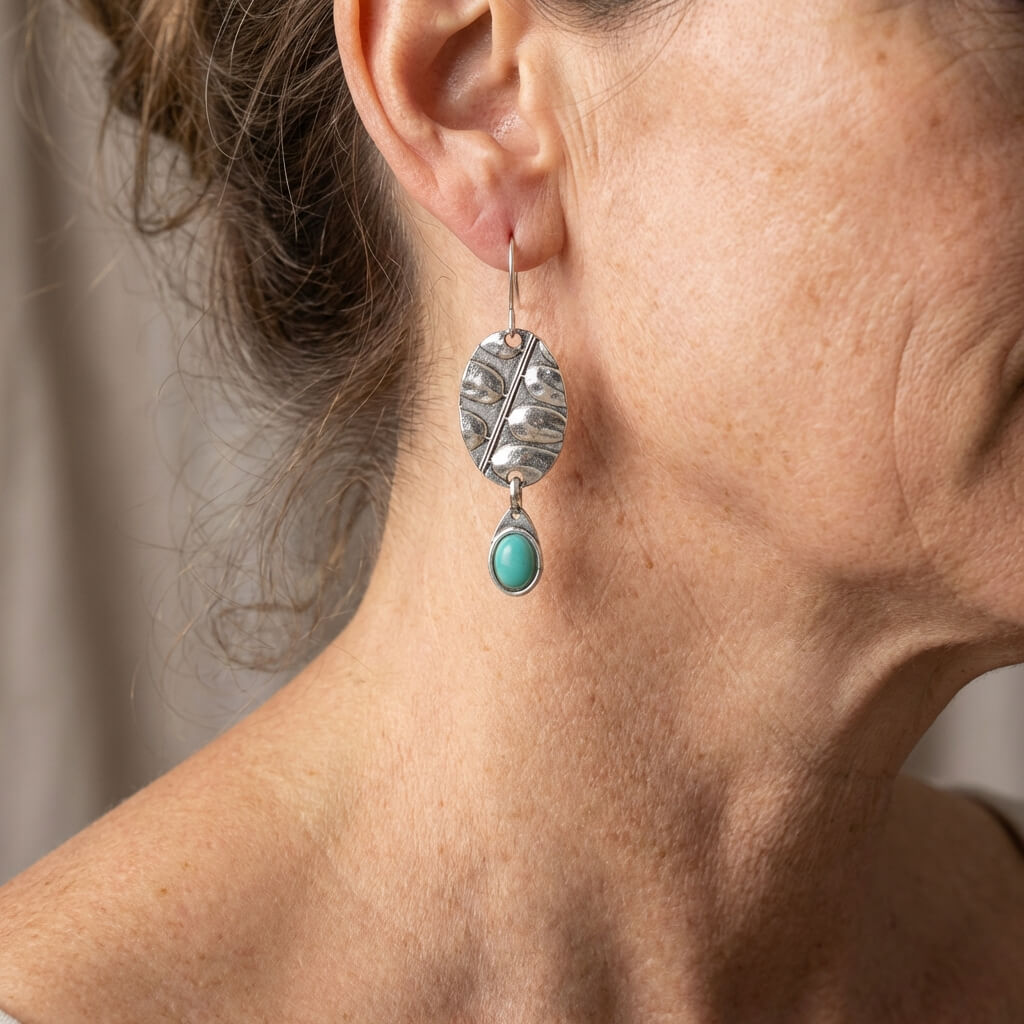 Zilveren botanische oorbellen met turquoise druppel