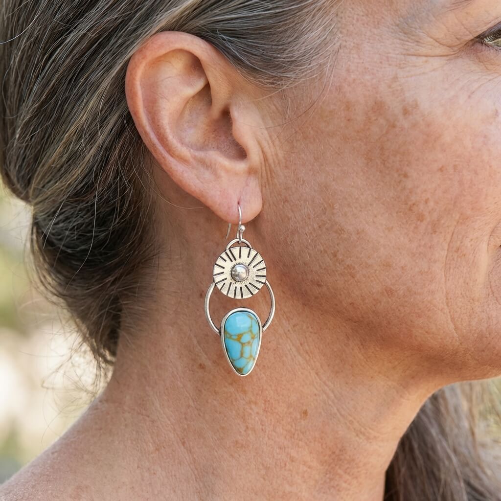 Zilveren vintage oorbellen met turquoise en zonnestraal