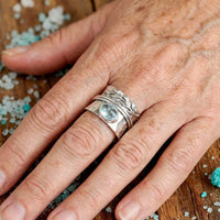 Zilveren spinner-ring met aquamarijn en bladmotief