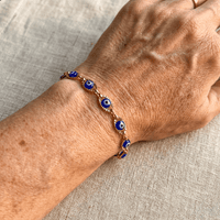 Gouden armband met blauwe boze oog kraaltjes