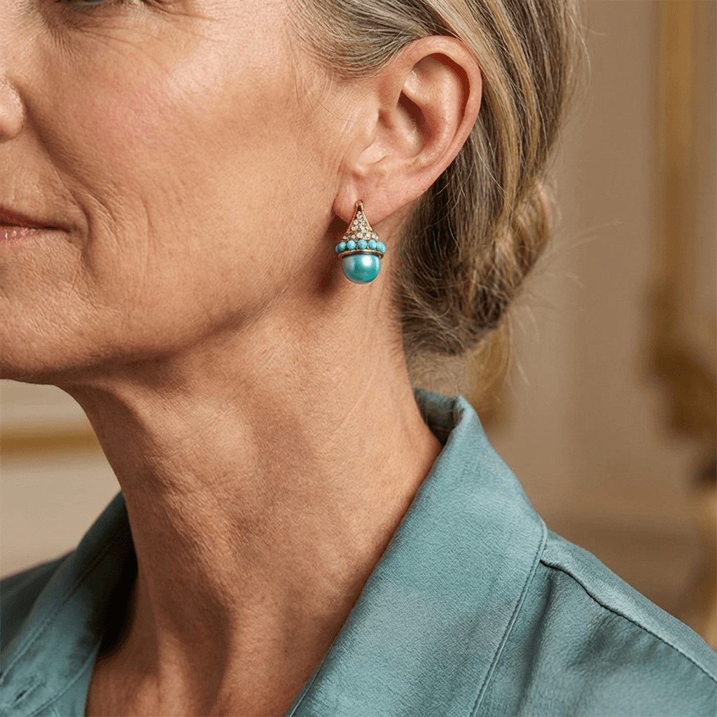 Vintage gouden oorbellen met turquoise parel