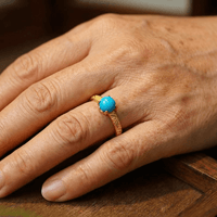 Gouden vintage ring met turquoise edelsteen