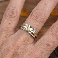 Zilveren spinner ring met gouden hart