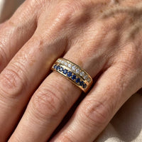 Gouden ring met blauwe en witte zirkonia