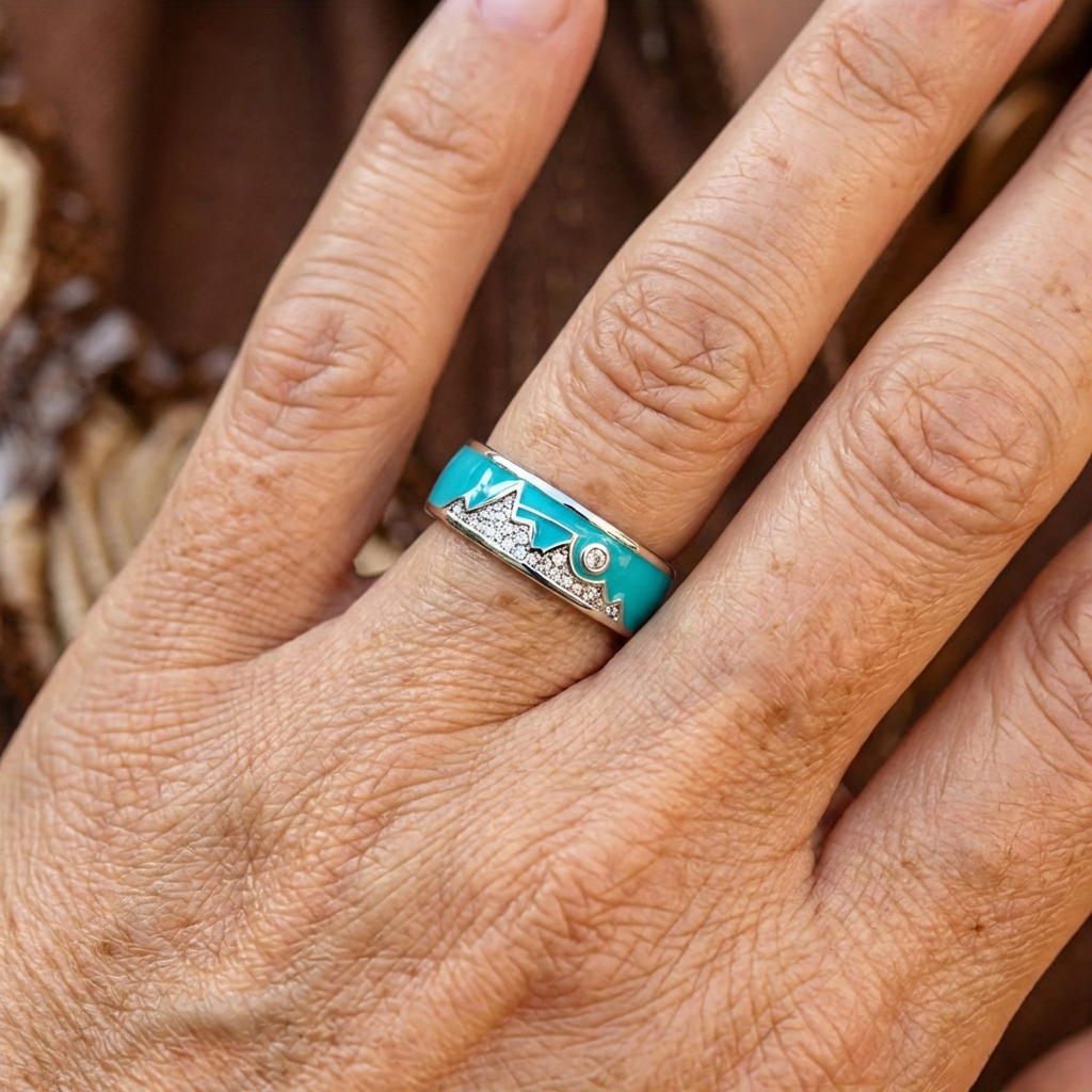 Zilveren ring met turquoise emaille berg-zonmotief en zirkonia