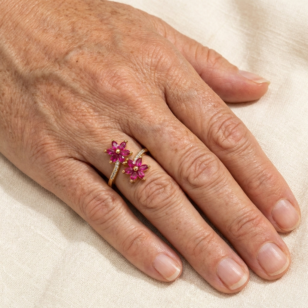 Gouden ring met twee roze zirkonia bloemen
