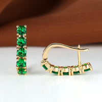 Gouden oorbellen met groene edelstenen