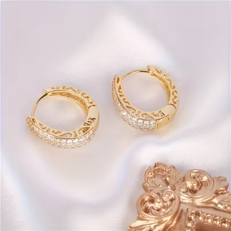 Gouden ovale oorbellen met zirconia pavé