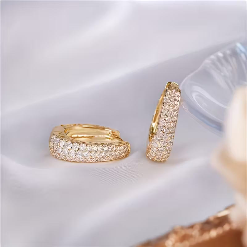 Gouden ovale oorbellen met zirconia pavé