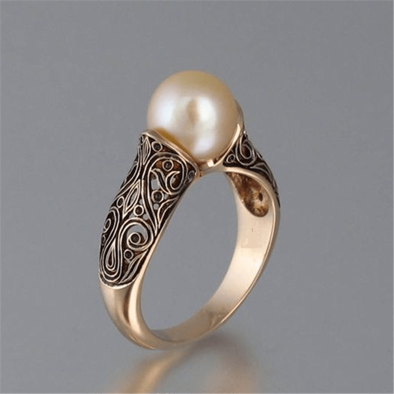 Gouden vintage ring met parel en gravering