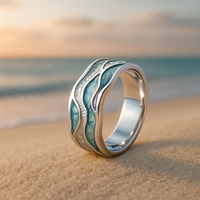 Zilveren ring met golvenmotief en blauwe inleg