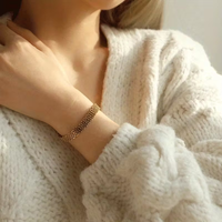 Brede gouden gevlochten mesh-armband