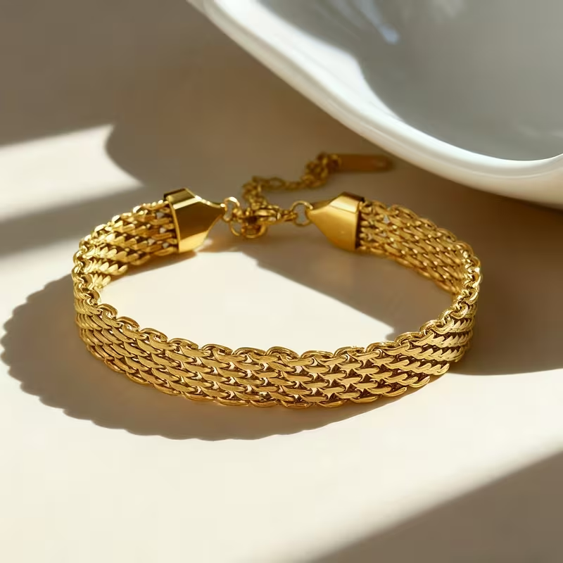 Brede gouden gevlochten mesh-armband