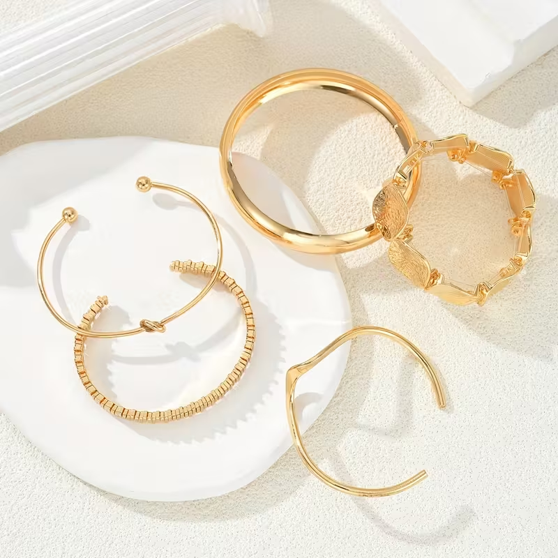 Gouden armbandenset met cuff en discs