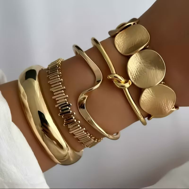Gouden armbandenset met cuff en discs
