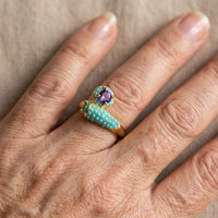 Gouden ring met turkoois en paarse edelsteen