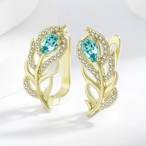 Gouden oorbellen met turquoise blad en zirkonia