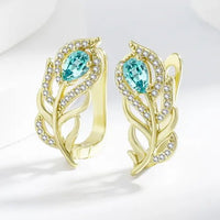 Gouden oorbellen met turquoise blad en zirkonia