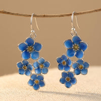 Zilveren oorbellen met blauwe emaille bloemen