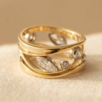 Gouden brede ring met marquise zirkonia