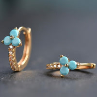 Gouden oorbellen met turquoise en zirkonia