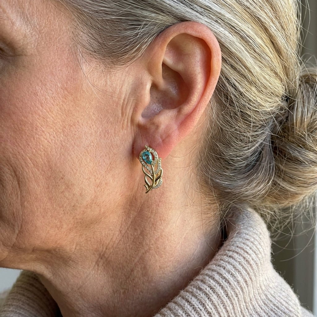Gouden oorbellen met turquoise blad en zirkonia