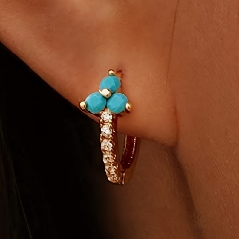 Gouden oorbellen met turquoise en zirkonia