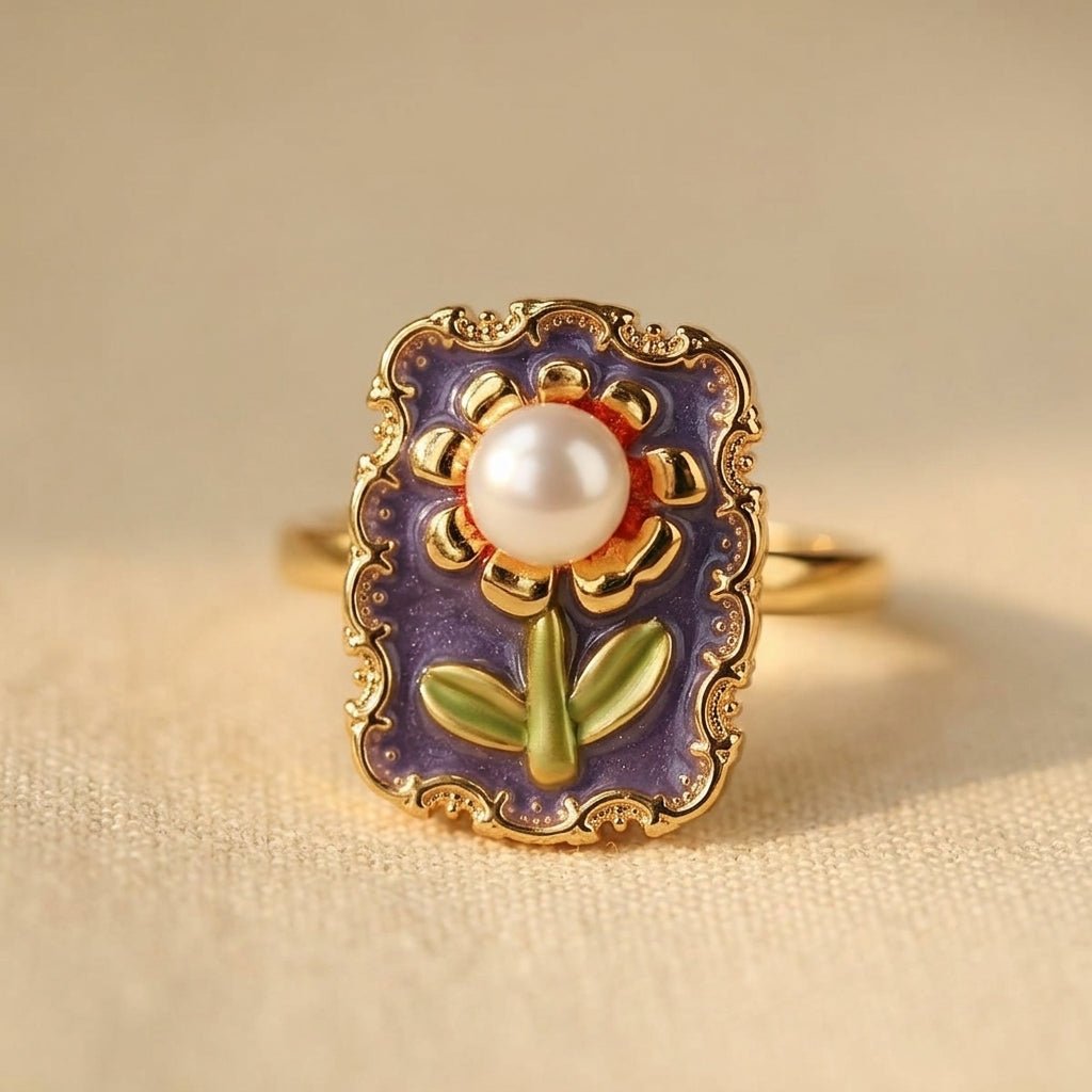 Gouden vintage ring met emaille bloem en parel