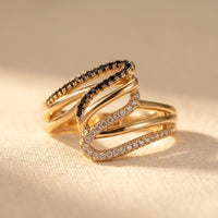 Gouden meerlaagse ring met zwarte en witte zirkonia