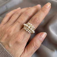 Gouden brede ring met parels en zirkonia