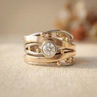 Zilveren en gouden ring met zirkonia en gouden kraaltjes