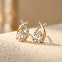 Gouden oorbellen met zirkonia en kristal